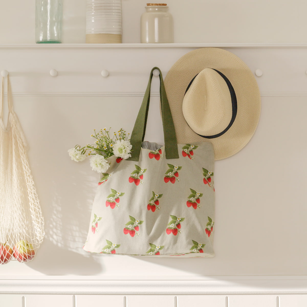 http://www.sophieallport.com/cdn/shop/files/ss23-strawberries-all97540-everydayshoppingbag-square.jpg?v=1683120761