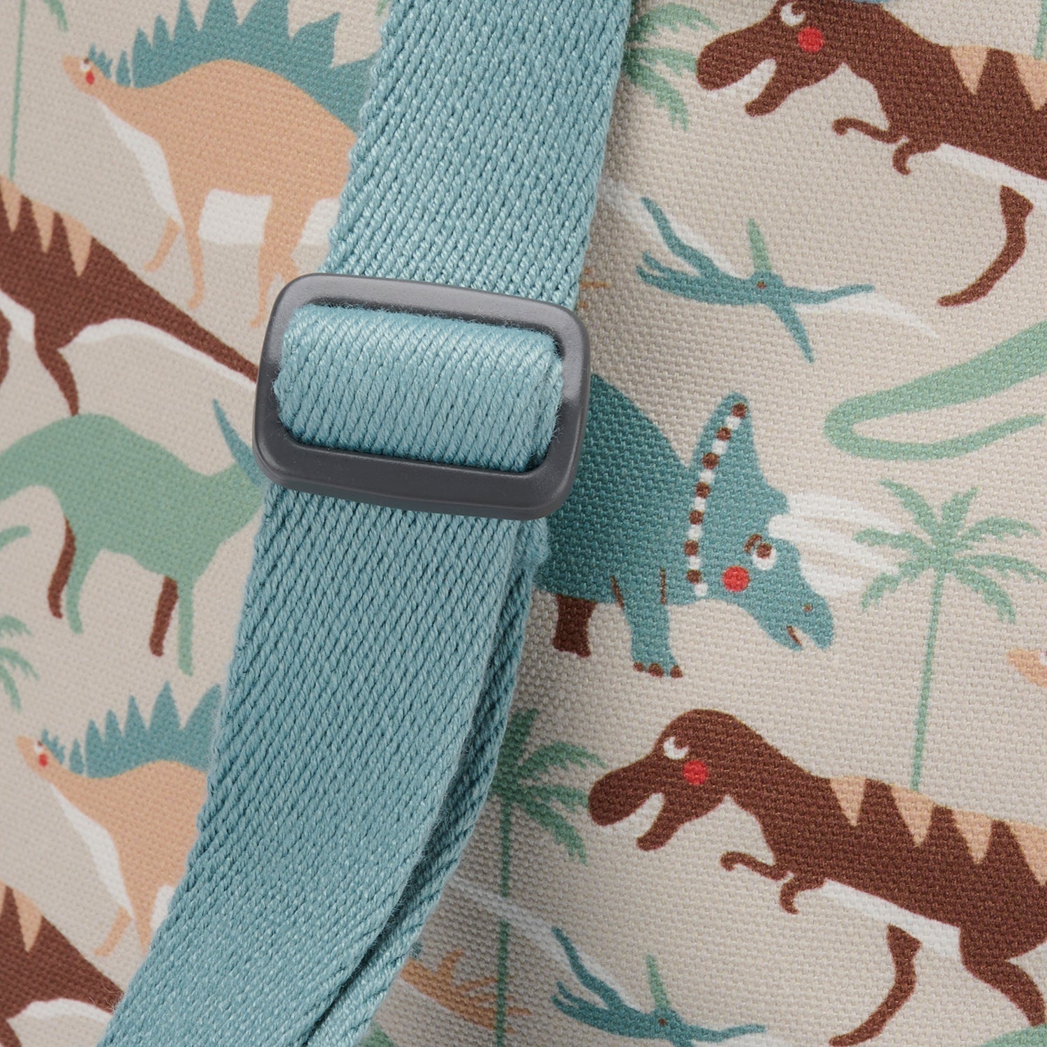 Dinosaur Camouflage Backpack by Sophie Allport, close up of bag strap