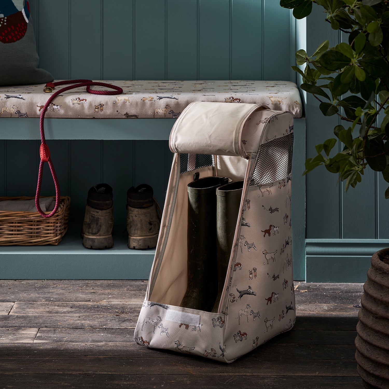 Doggy Daycare Boot Bag by Sophie Allport with wellies inside