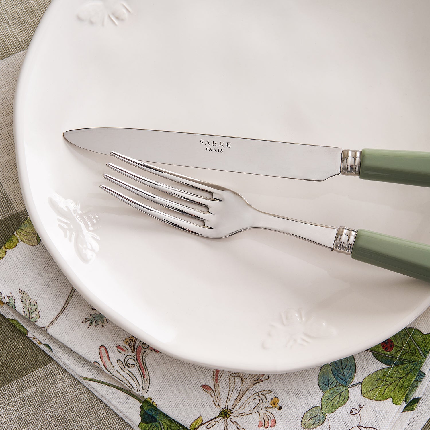 Stainless steel cutlery set with green handles by Sophie Allport detail