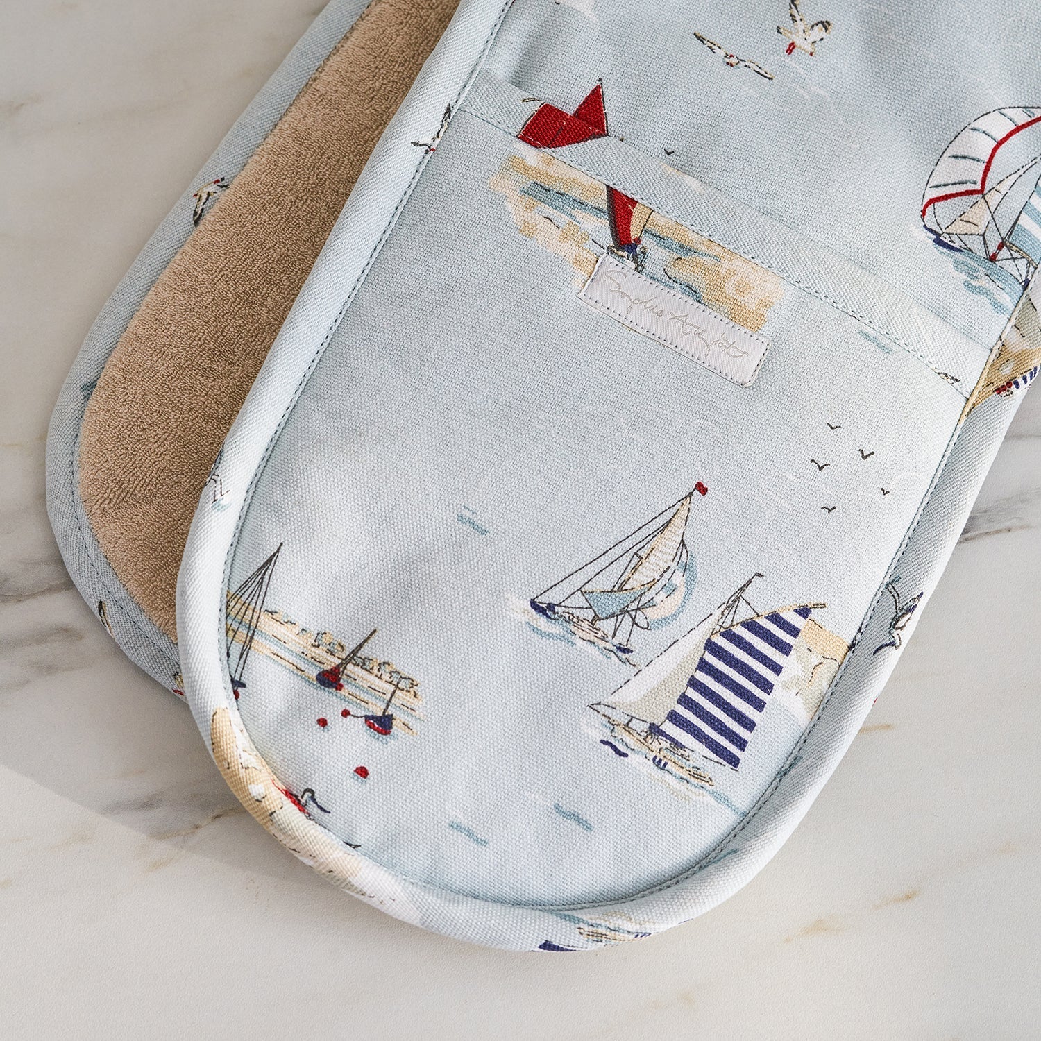 Blue double oven glove with sailing boat print by Sophie Allport detail