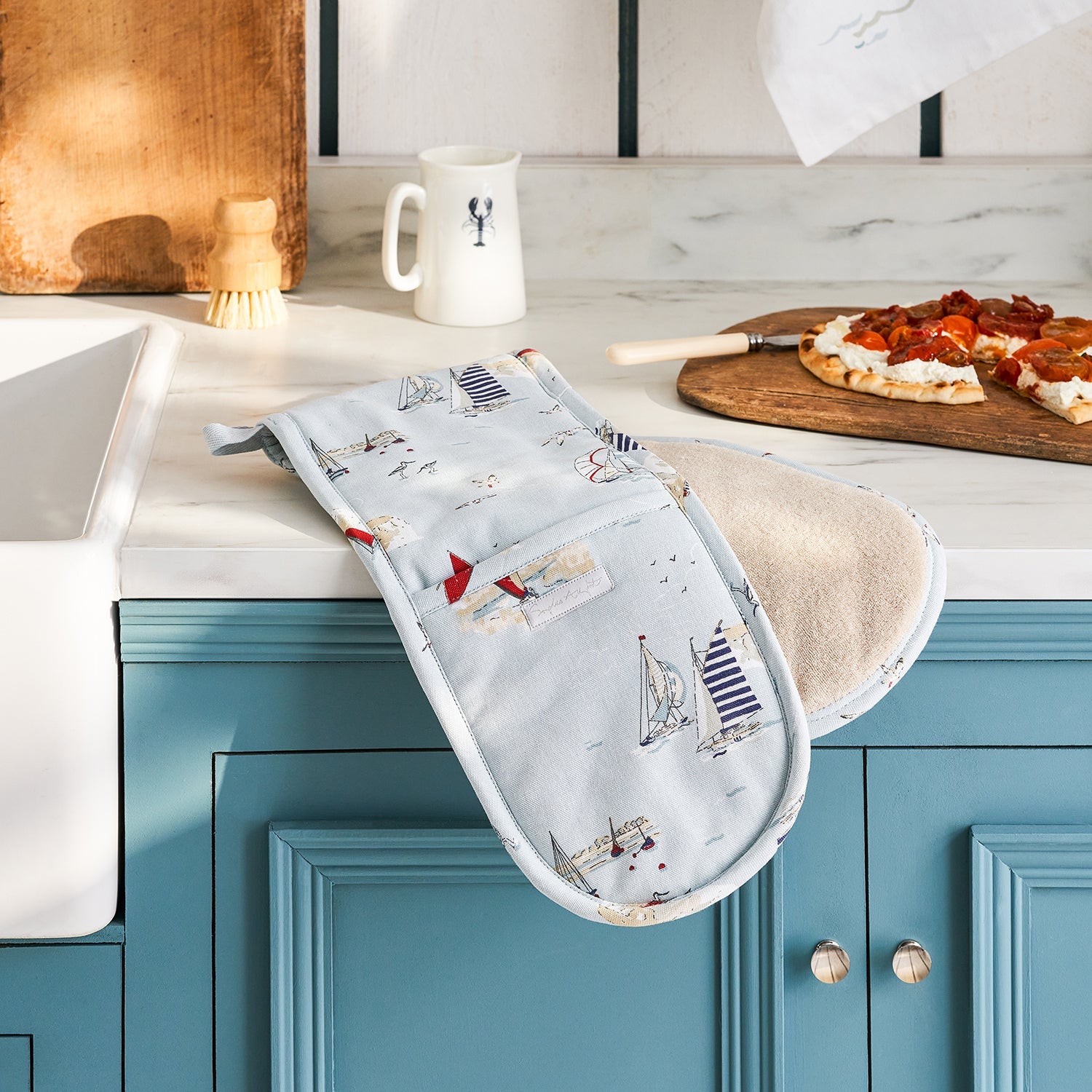 Blue double oven glove with sailing boat print by Sophie Allport