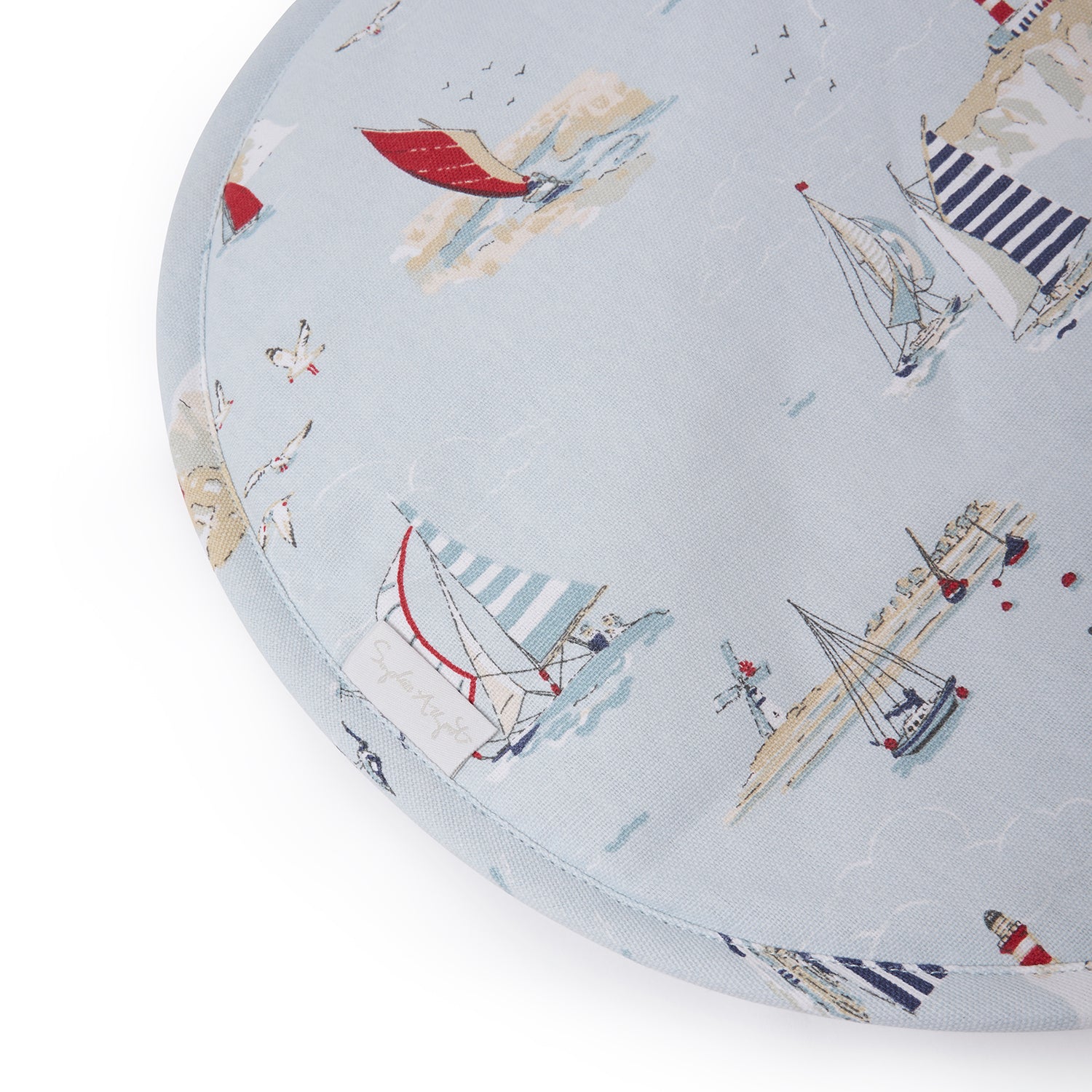 Blue hob covers with coastal sailing boats print by Sophie Allport tag detail