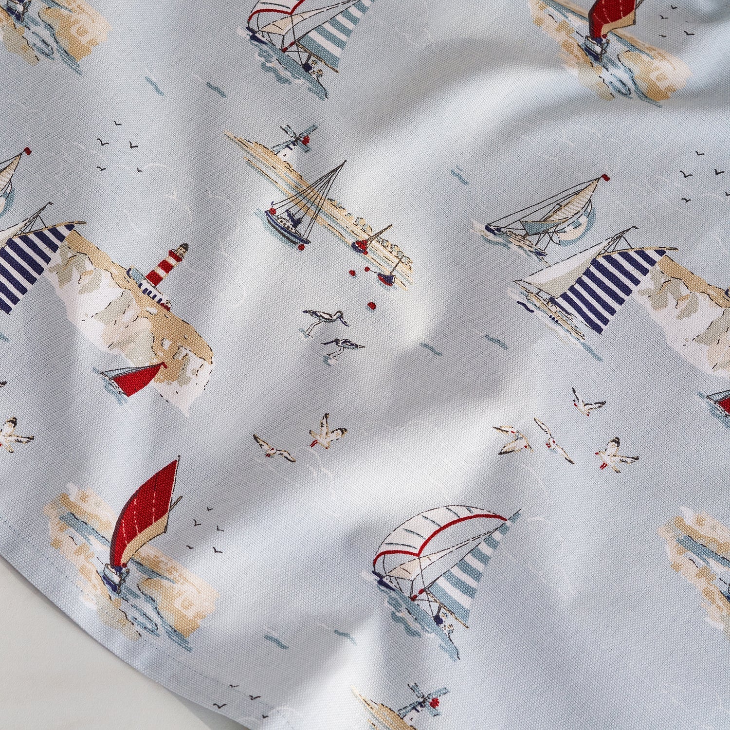 Blue tea towel with coastal boats print by Sophie Allport detail