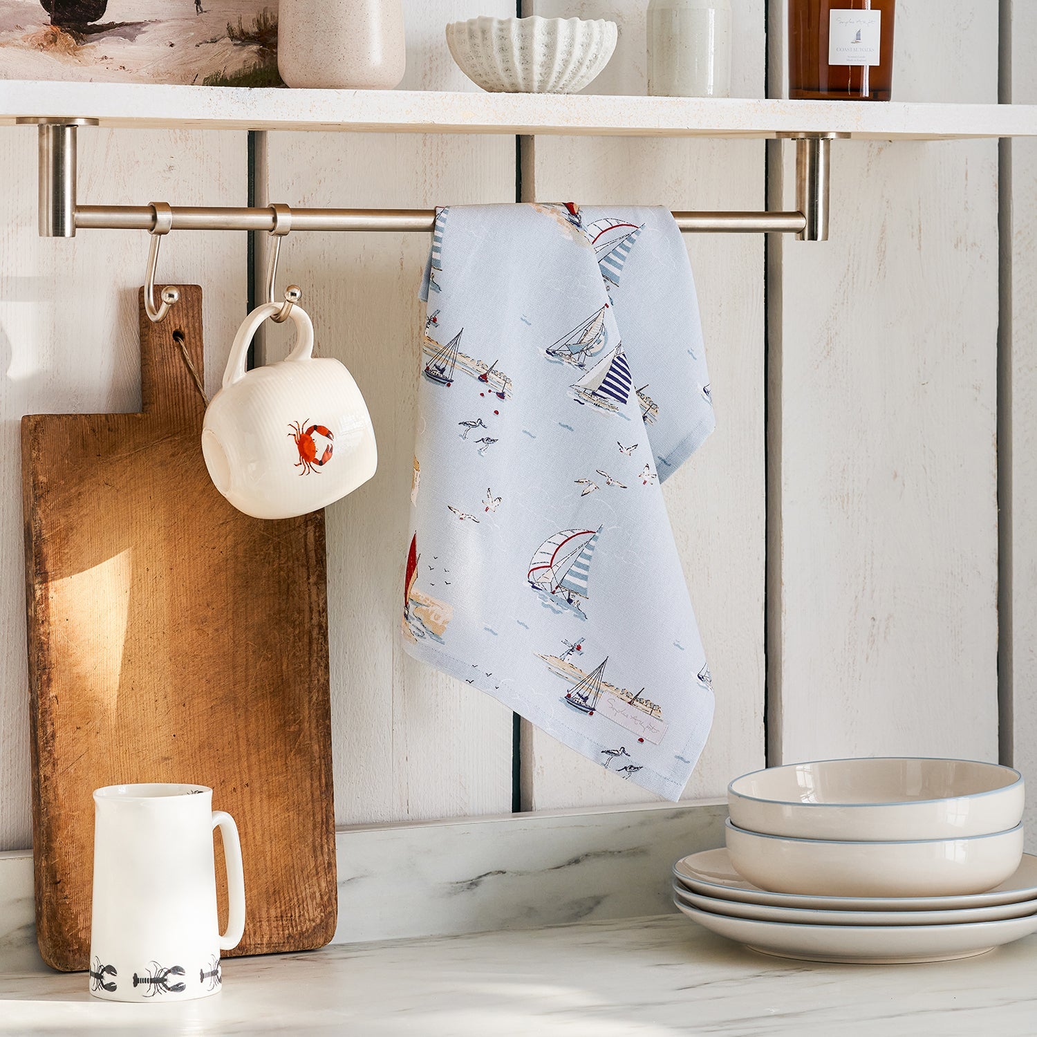 Blue tea towel with coastal boats print by Sophie Allport