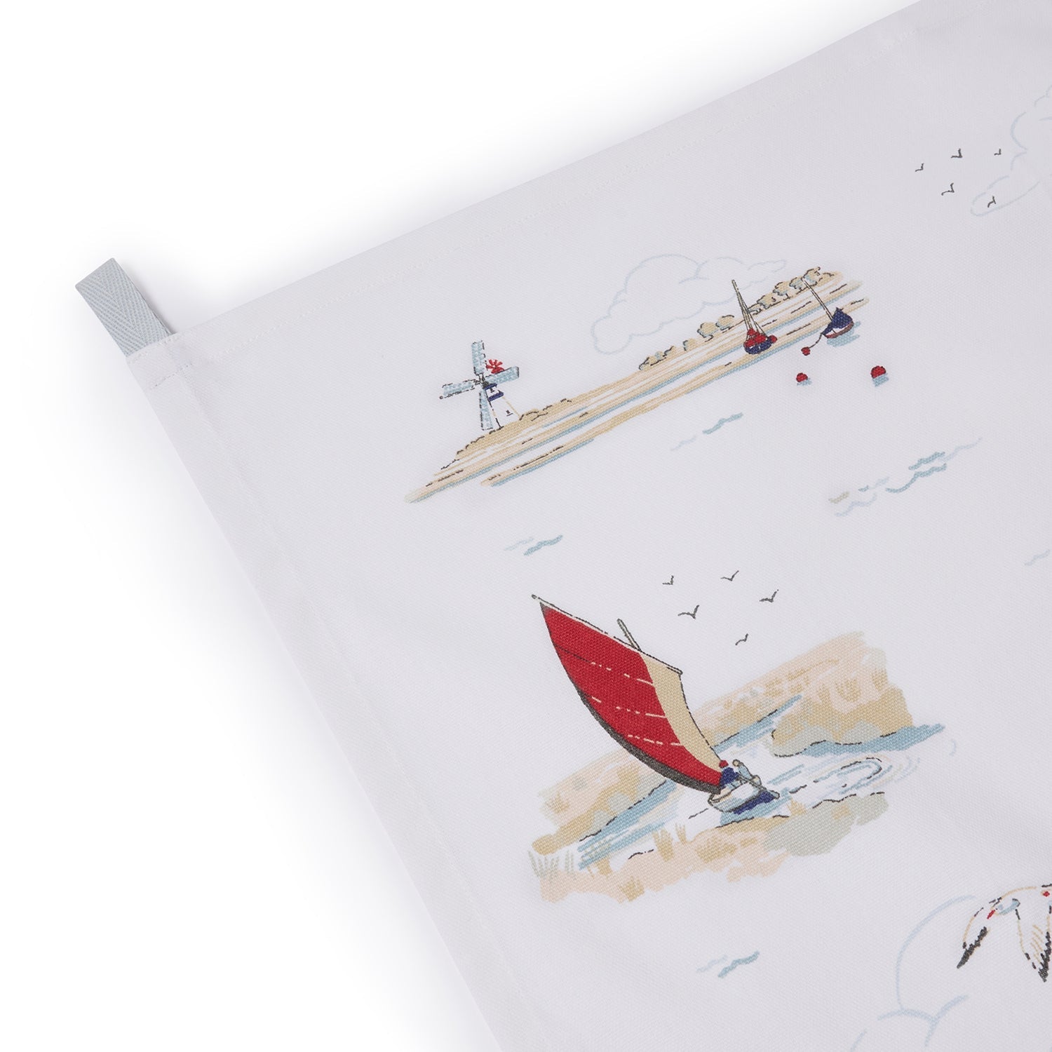 White tea towel with coastal sailing boats by Sophie Allport hanging loop