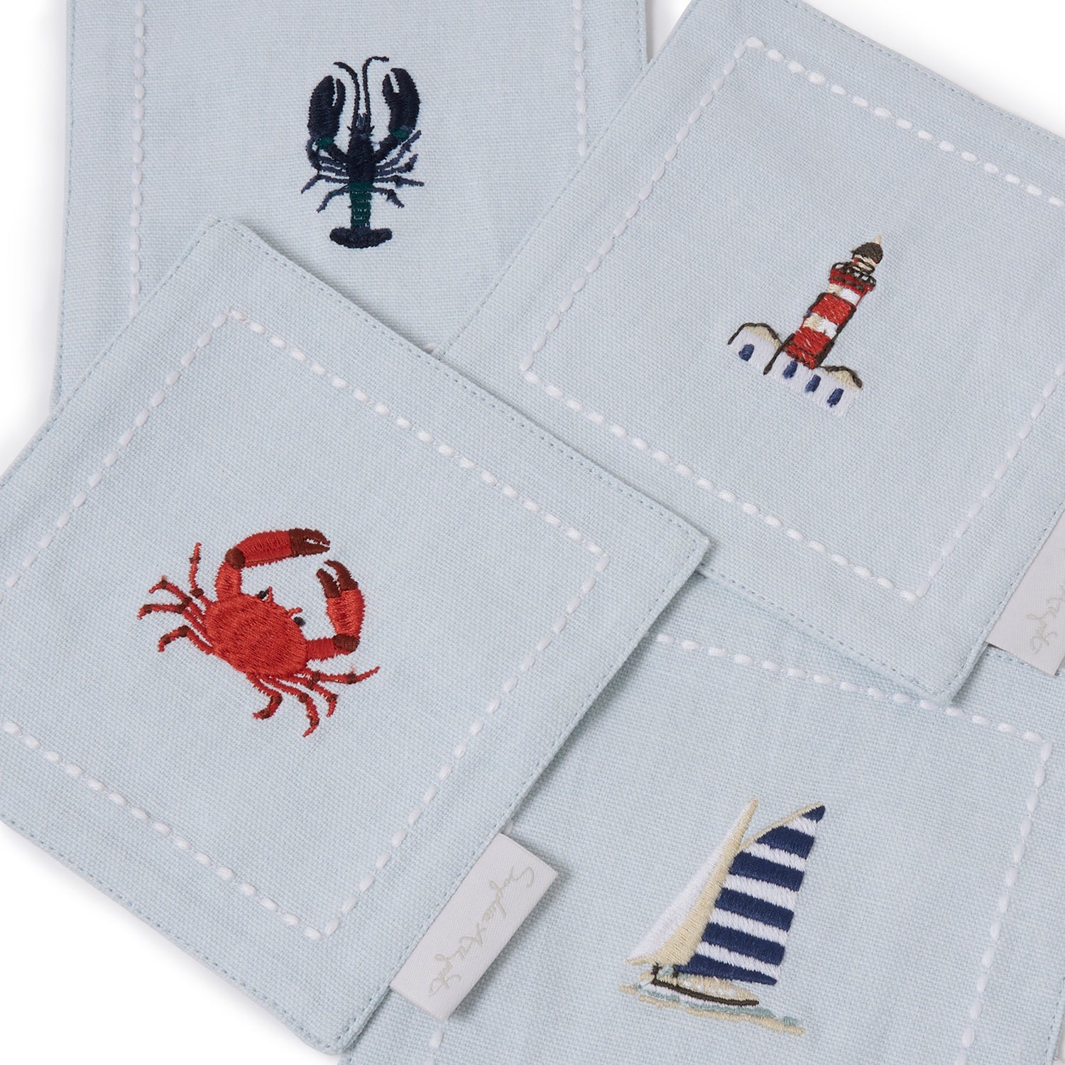 Blue drinks coasters with coastal lobster and crab print by Sophie Allport detail