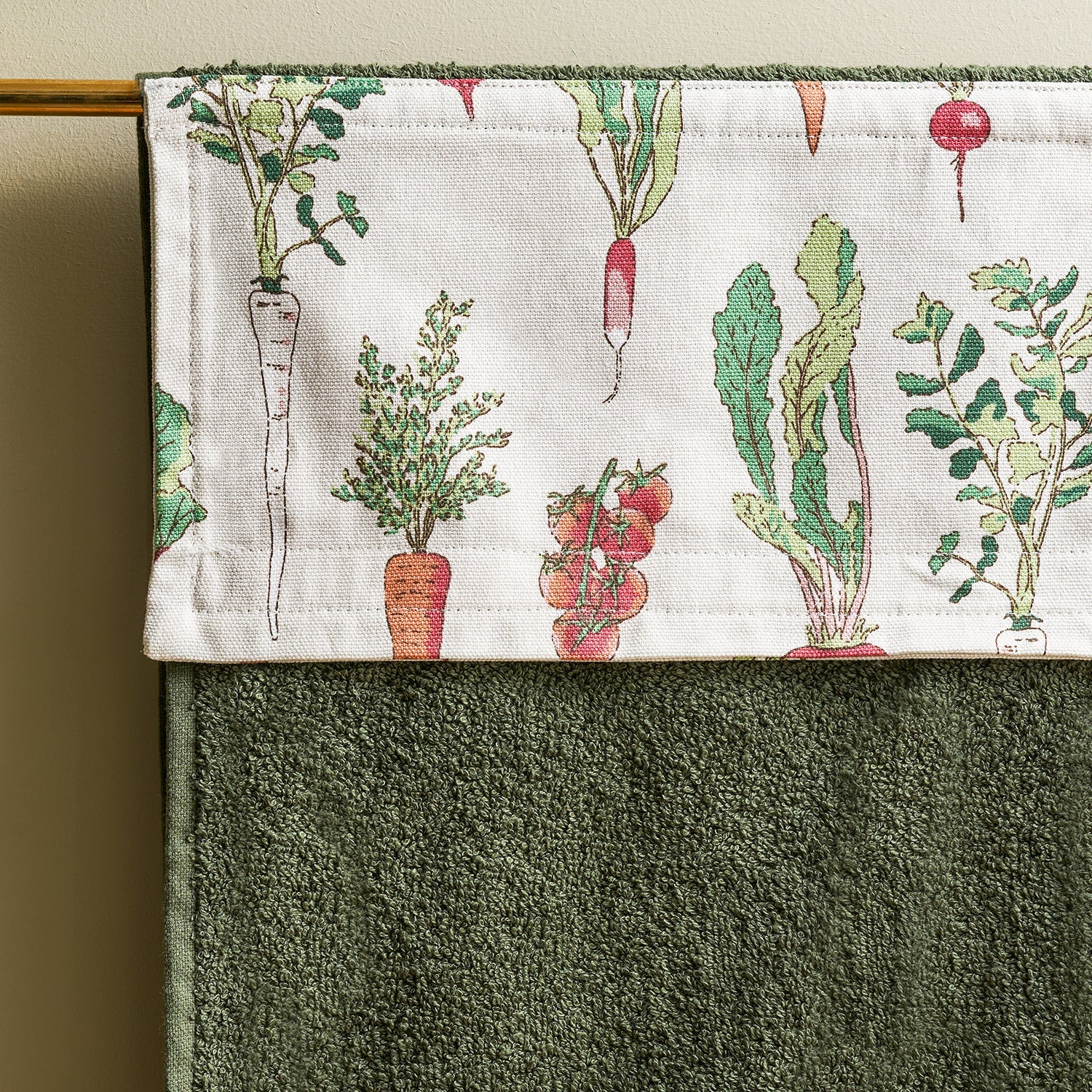 Green roller hand towel with garden vegetables print by Sophie Allport detail