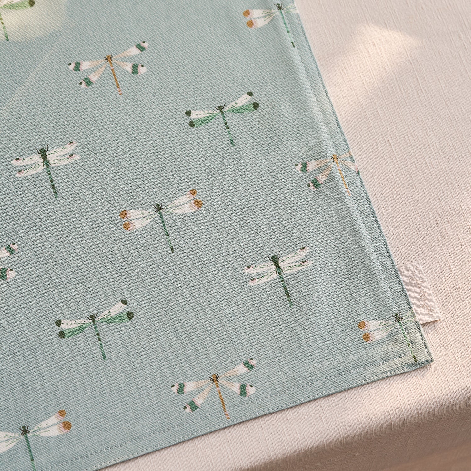 Blue fabric placemats with dragonfly print by Sophie Allport detail