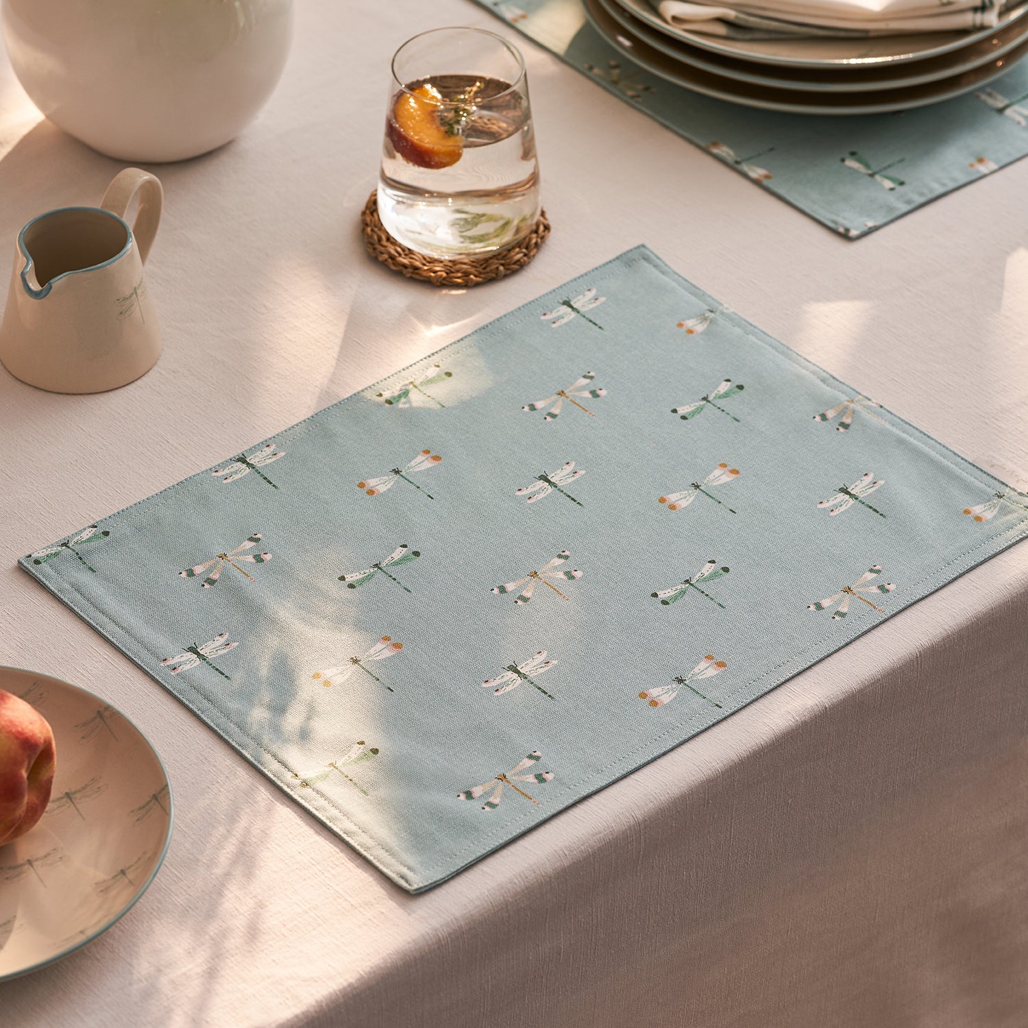 Blue fabric placemats with dragonfly print by Sophie Allport