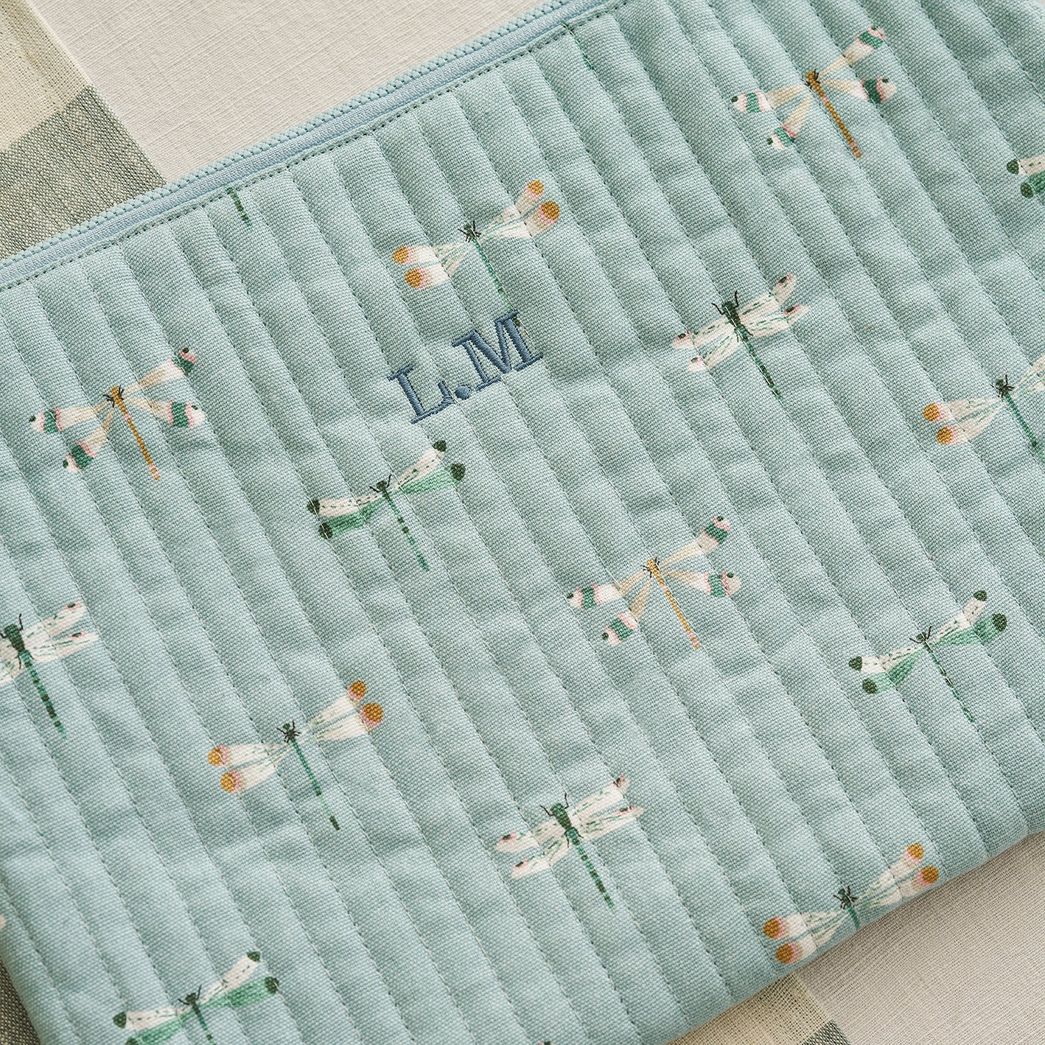 Blue cotton laptop cases with dragonfly print by Sophie Allport personalised detail