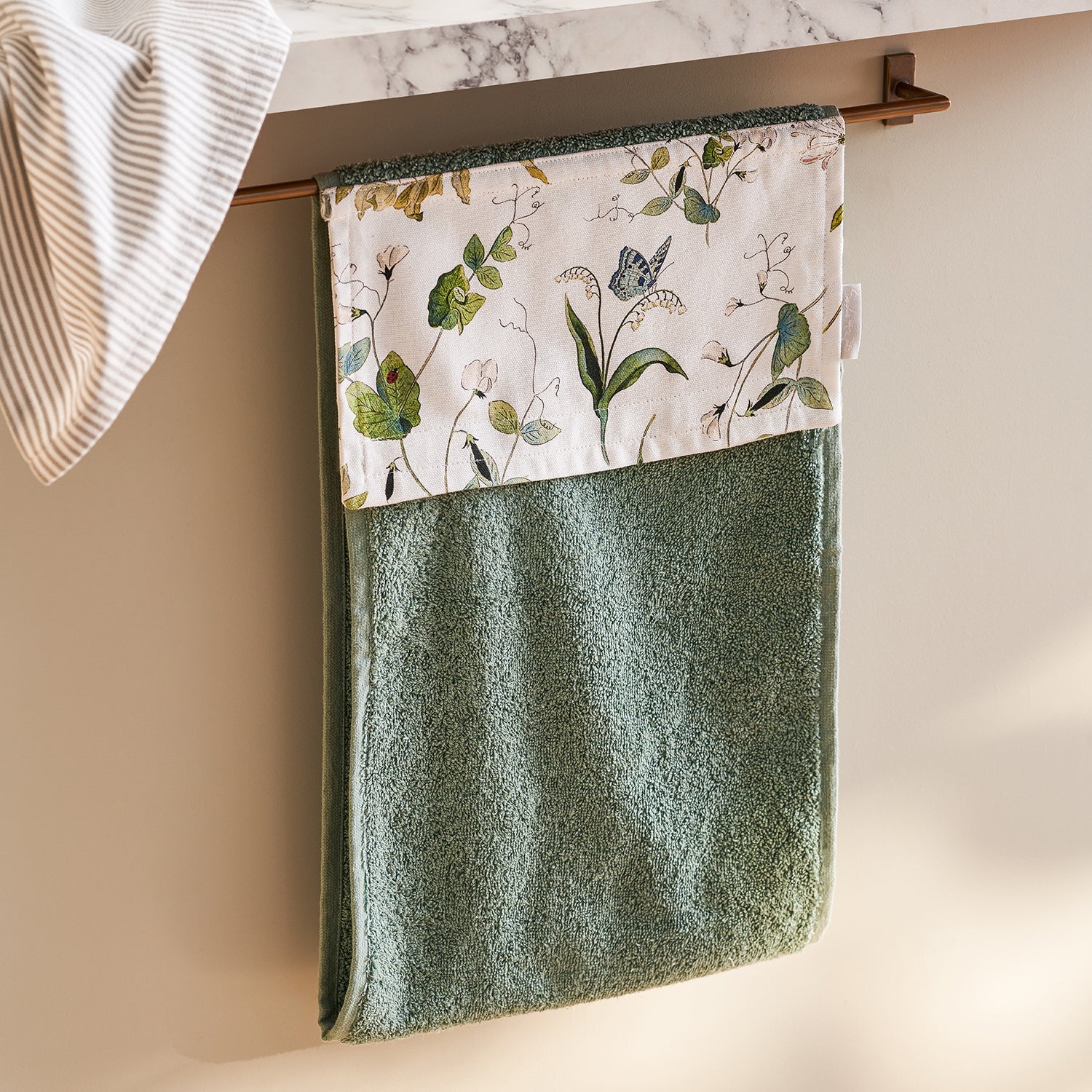 Green roller hand towel with floral print by Sophie Allport