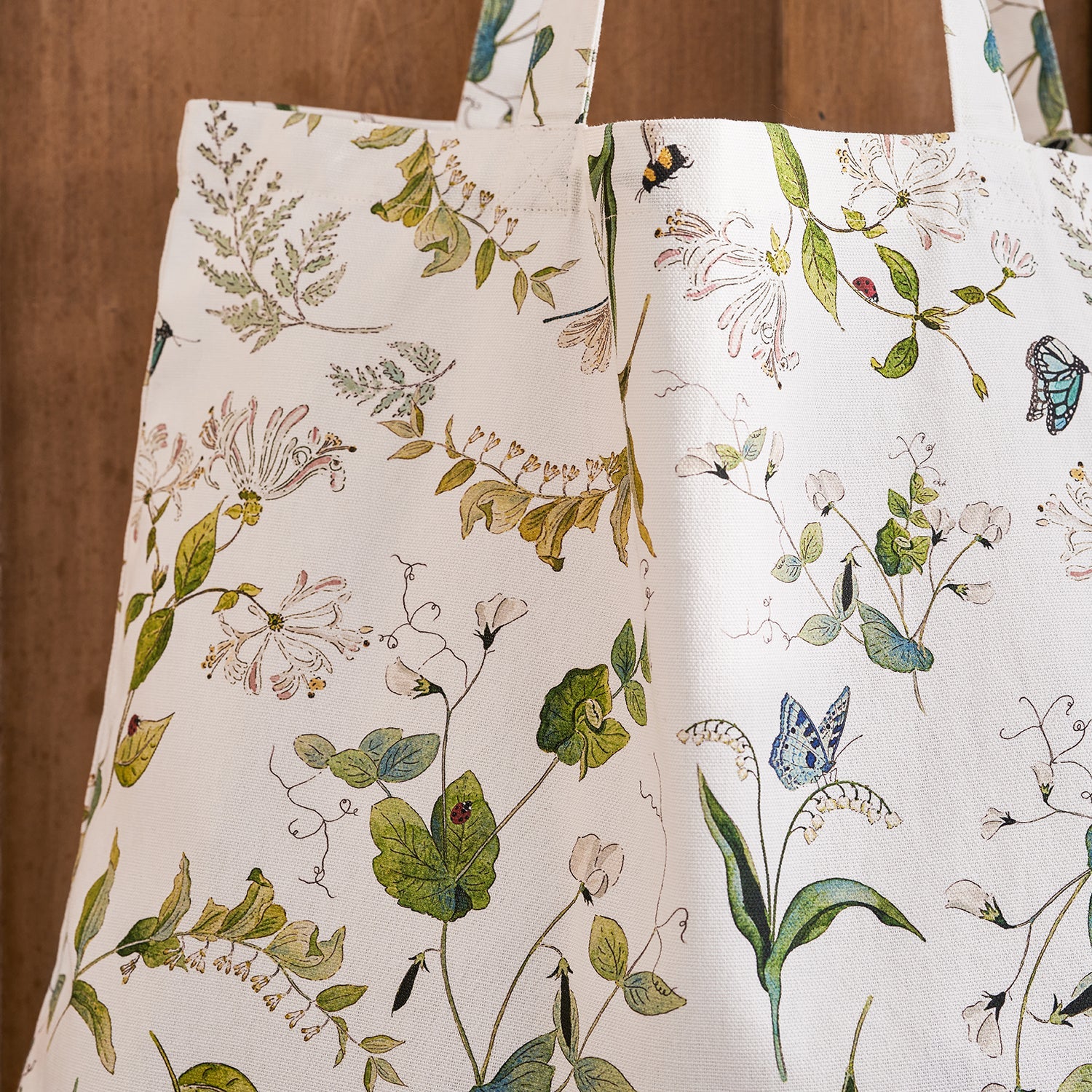 White tote bag with floral print by Sophie Allport detail