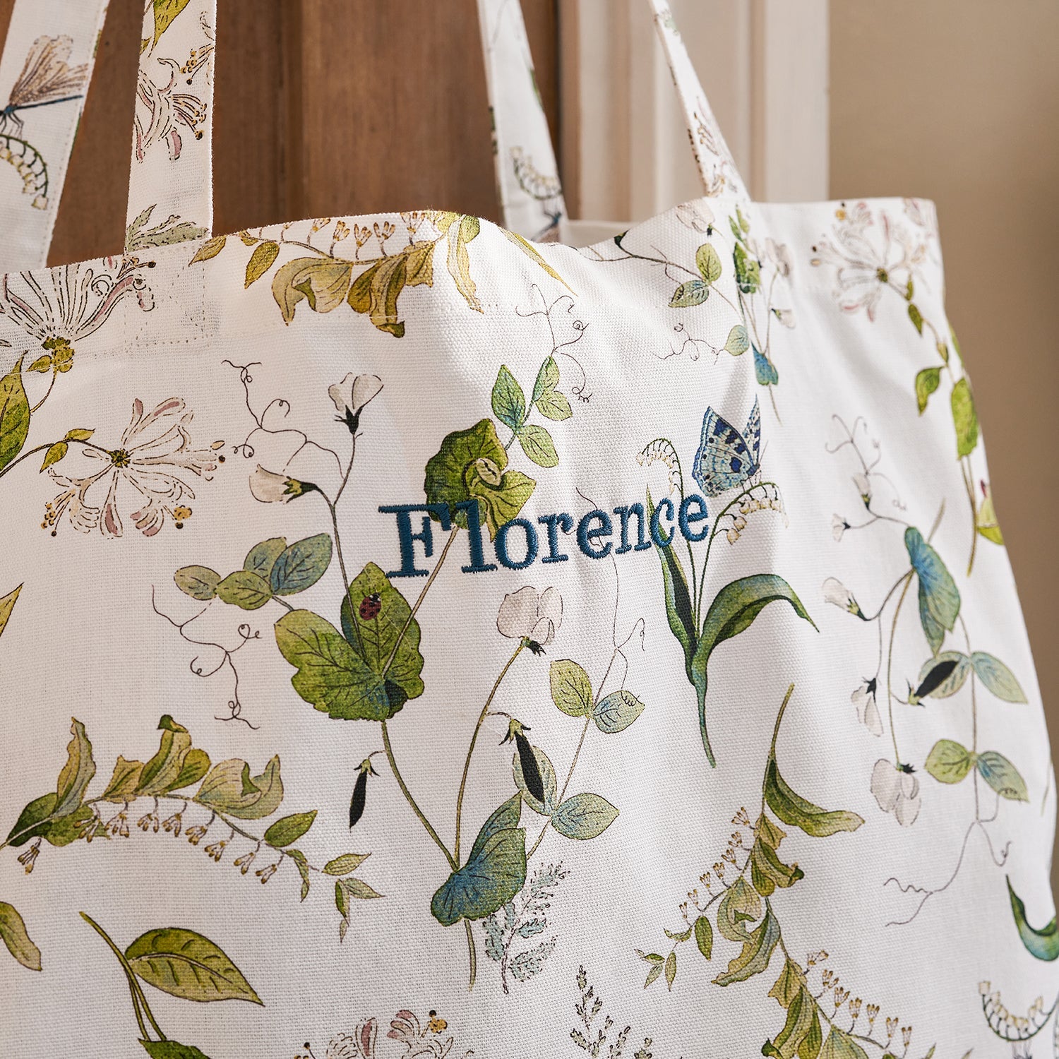 White tote bag with floral print by Sophie Allport personalisation detail