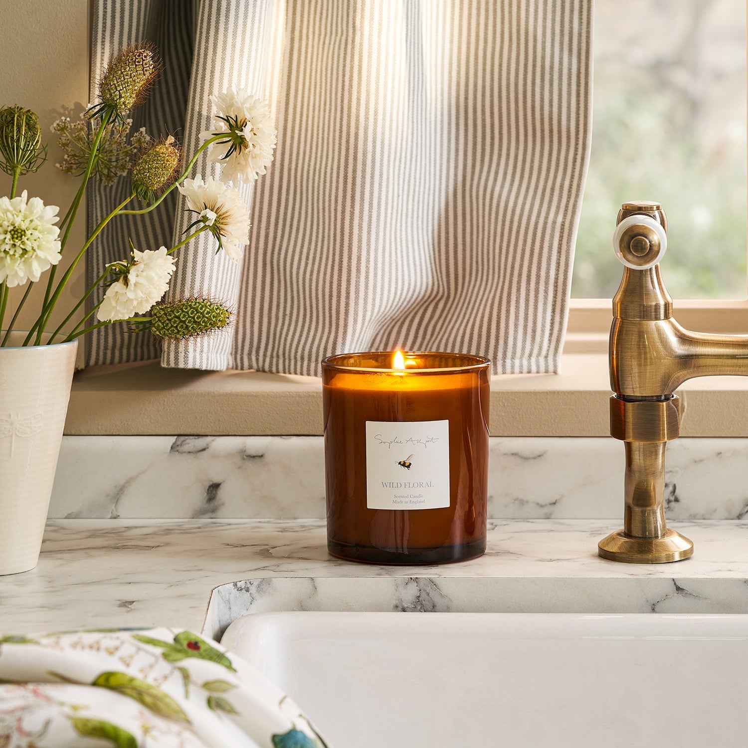 Floral scent glass candle by Sophie Allport