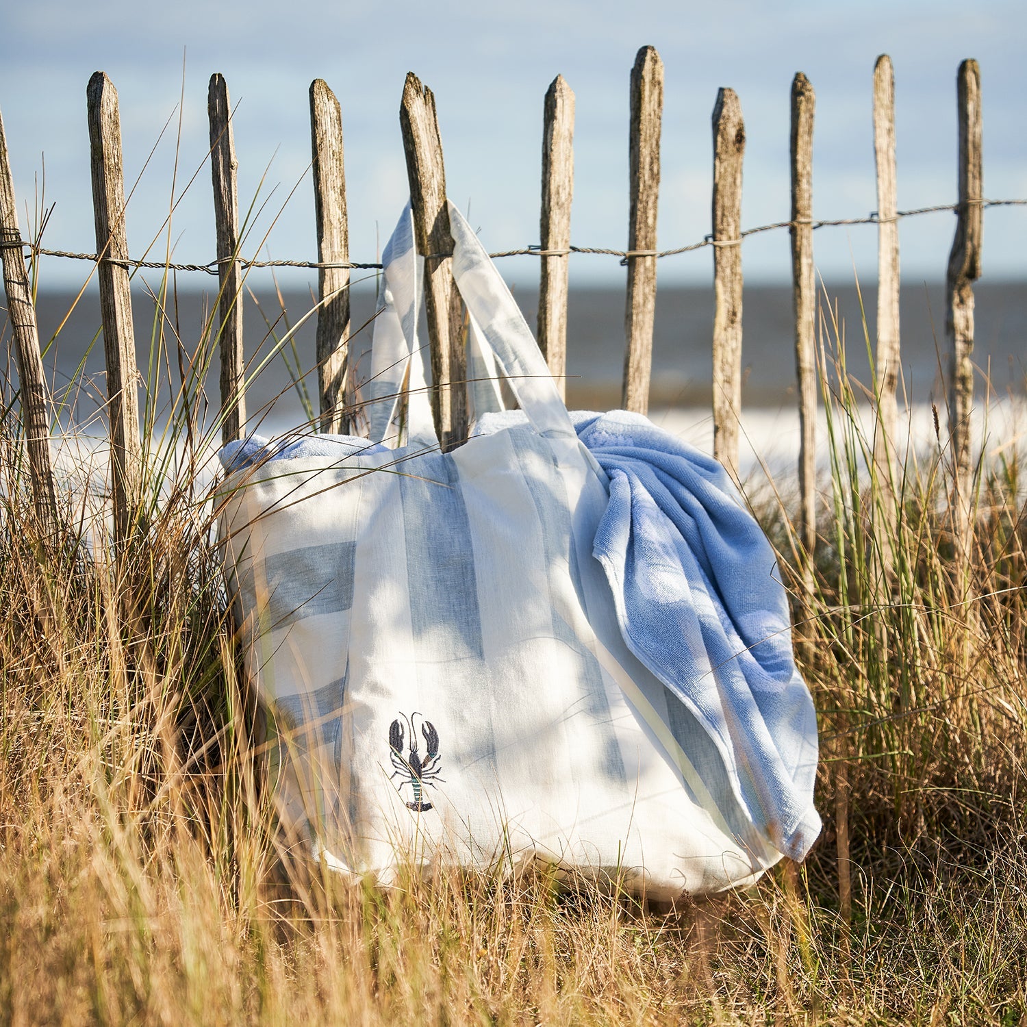 Blue and white stripe linen bag with lobster print by Sophie Allport