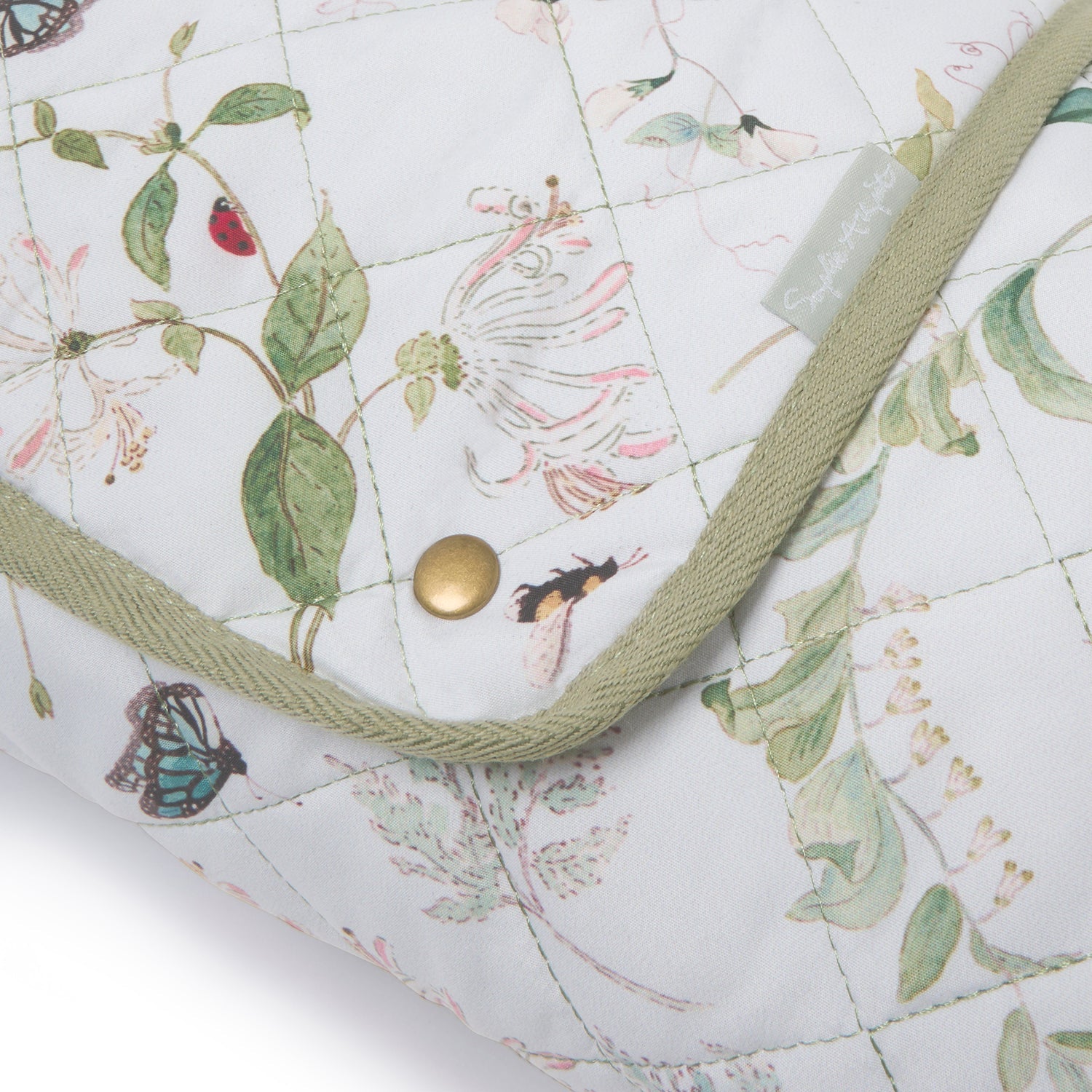 White picnic blanket with floral print by Sophie Allport folded