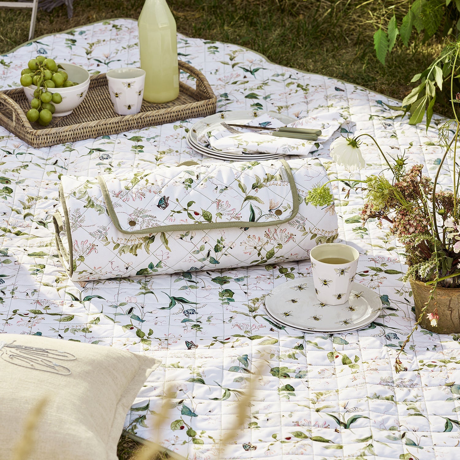 White picnic blanket with floral print by Sophie Allport