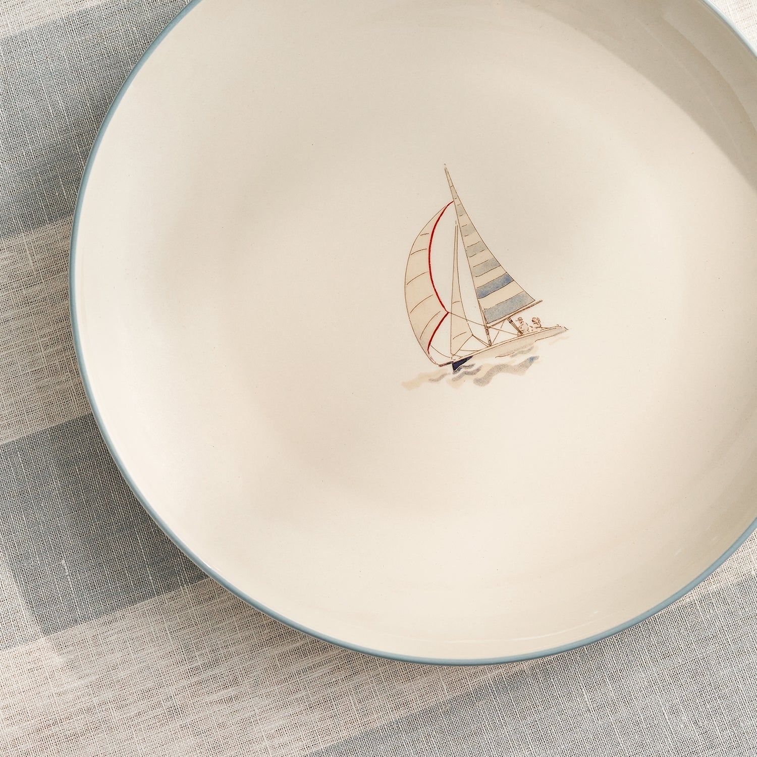 Stoneware dinner plate with red sailing boat by Sophie Allport detail