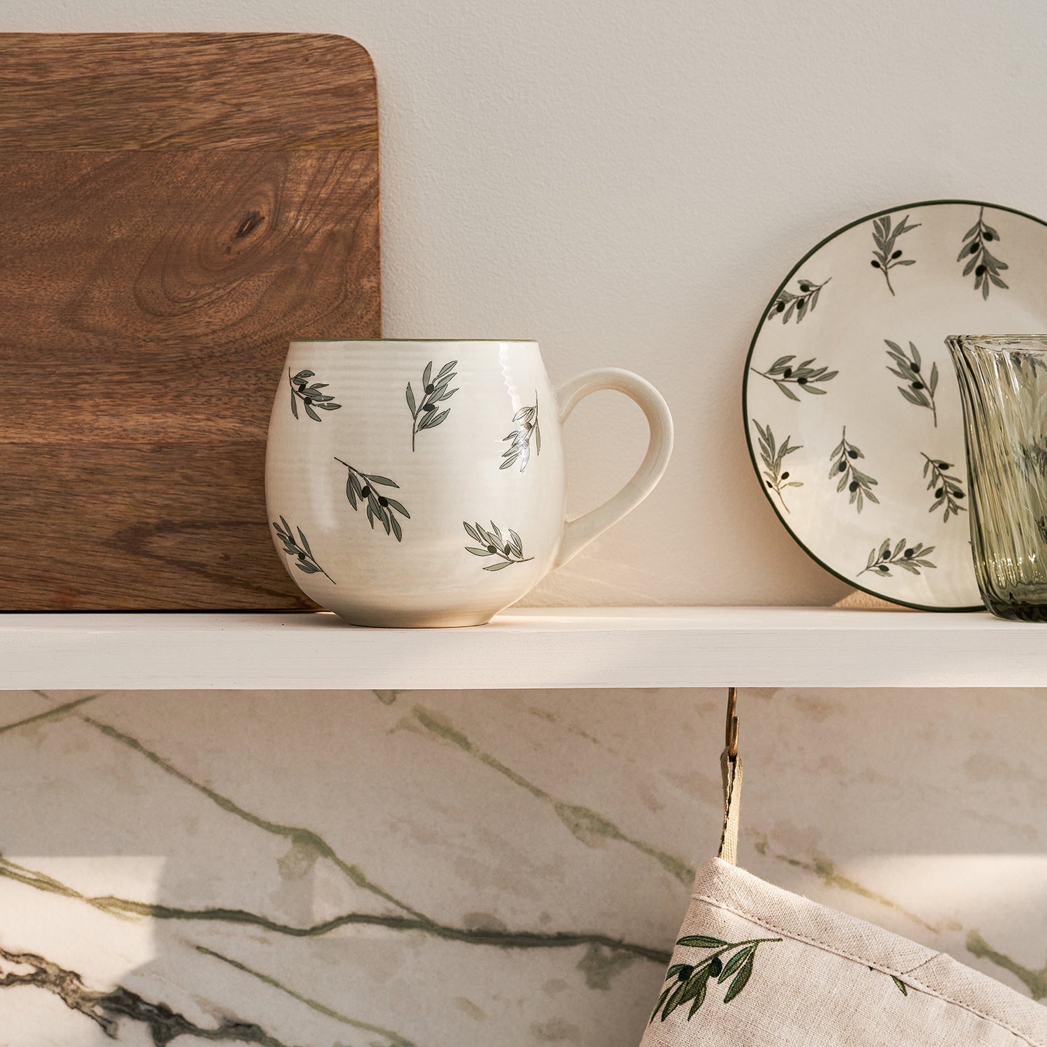 Stoneware mug with olive print by Sophie Allport