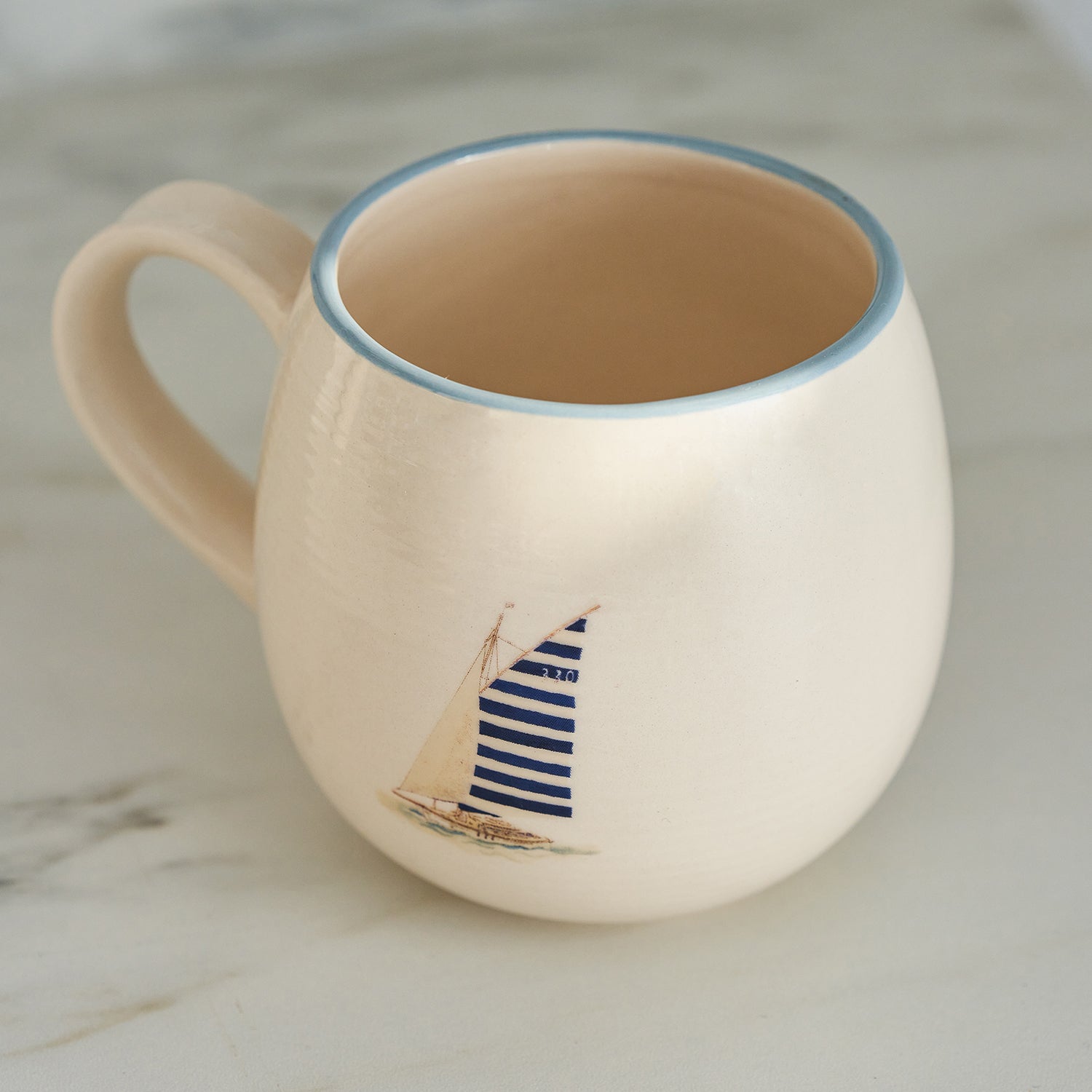 Stoneware mugs with coastal sailing boats print by Sophie Allport detail