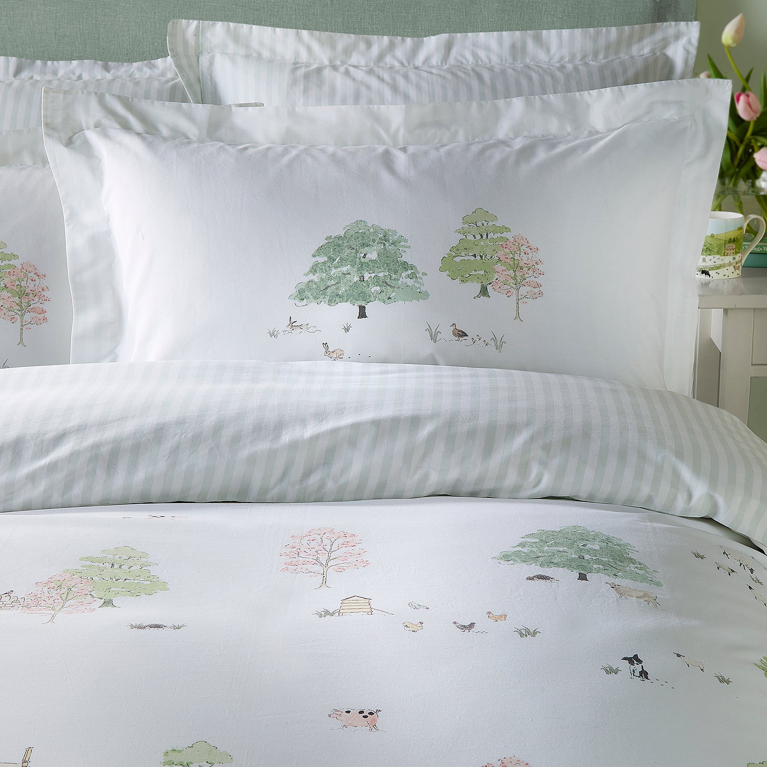 White cotton bedding set with spring cottage print by Sophie Allport reverse detail