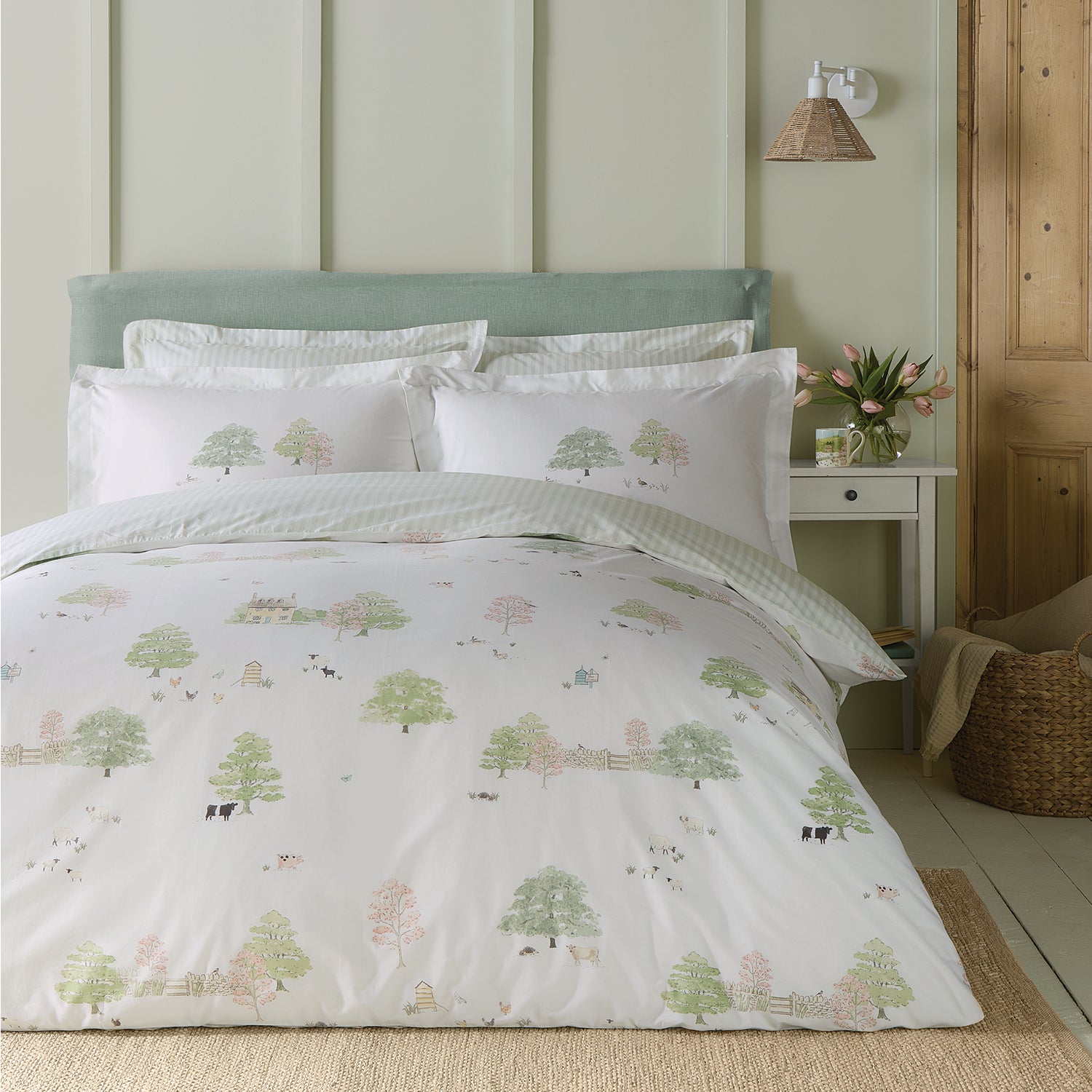 White cotton bedding set with spring cottage print by Sophie Allport bedroom scene