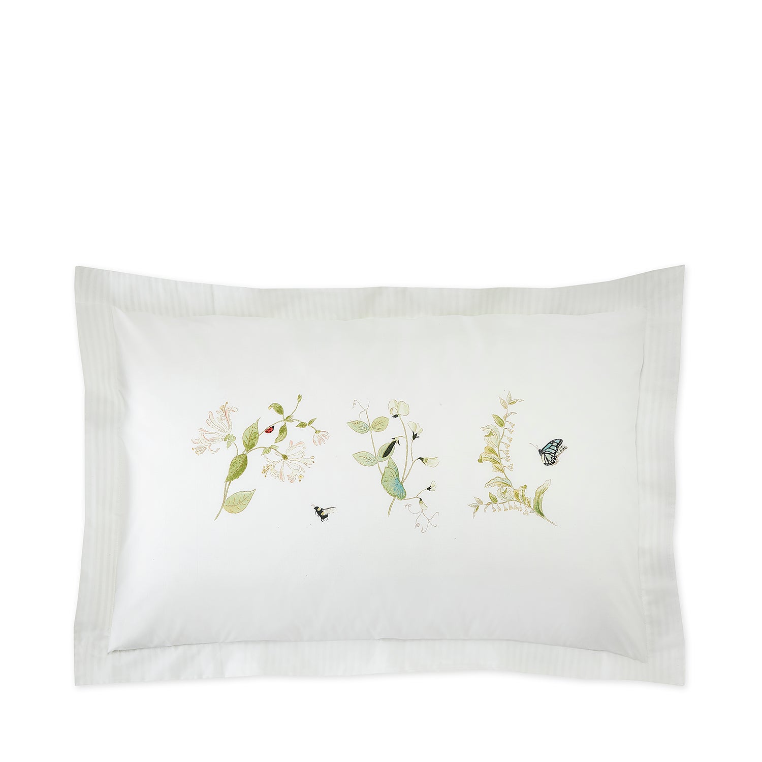 White cotton bedding set with floral print by Sophie Allport pillow design