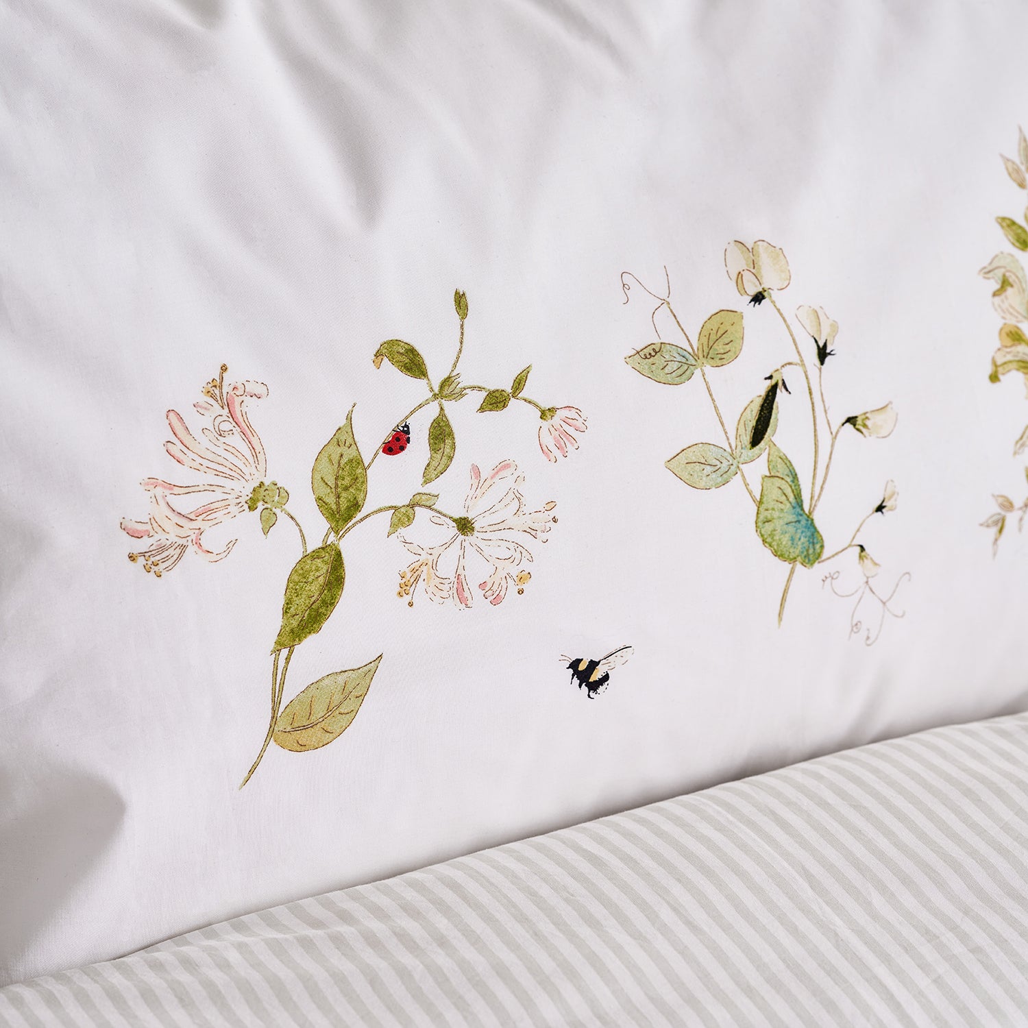 White oxford pillow cases with floral print by Sophie Allport detail